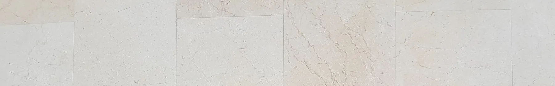 Botticino Cream marble wall tiles with a pale cream ground and fine broken veins