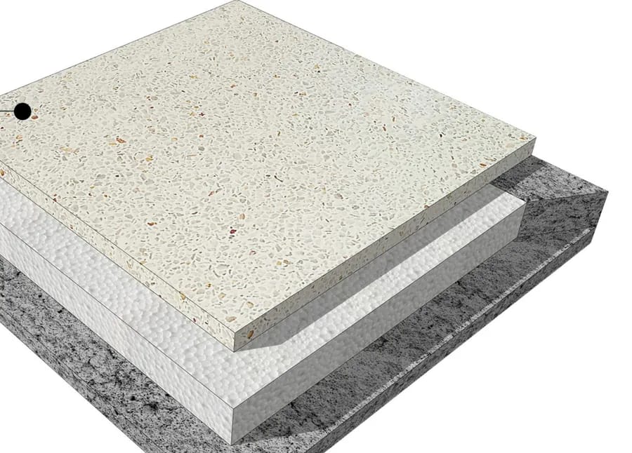 Cutaway of a washed terrazzo heat insulation tile: an exposed aggregate face over expanded polystyrene over foam concrete