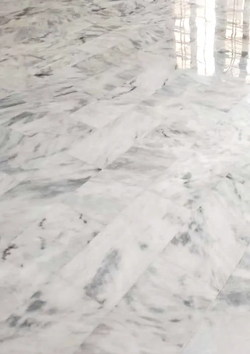 Polished Ziarat White marble floor with soft grey movement across the tiles
