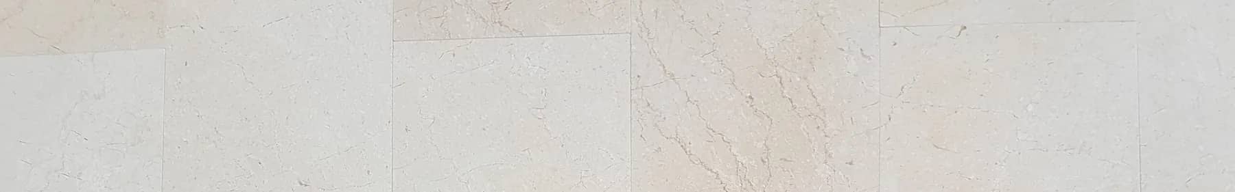 Botticino Cream marble wall tiles with a pale cream ground and fine broken veins