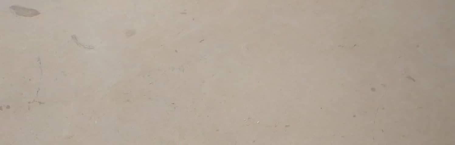Wide Verona Beige marble surface with a warm cream ground and quiet brown movement