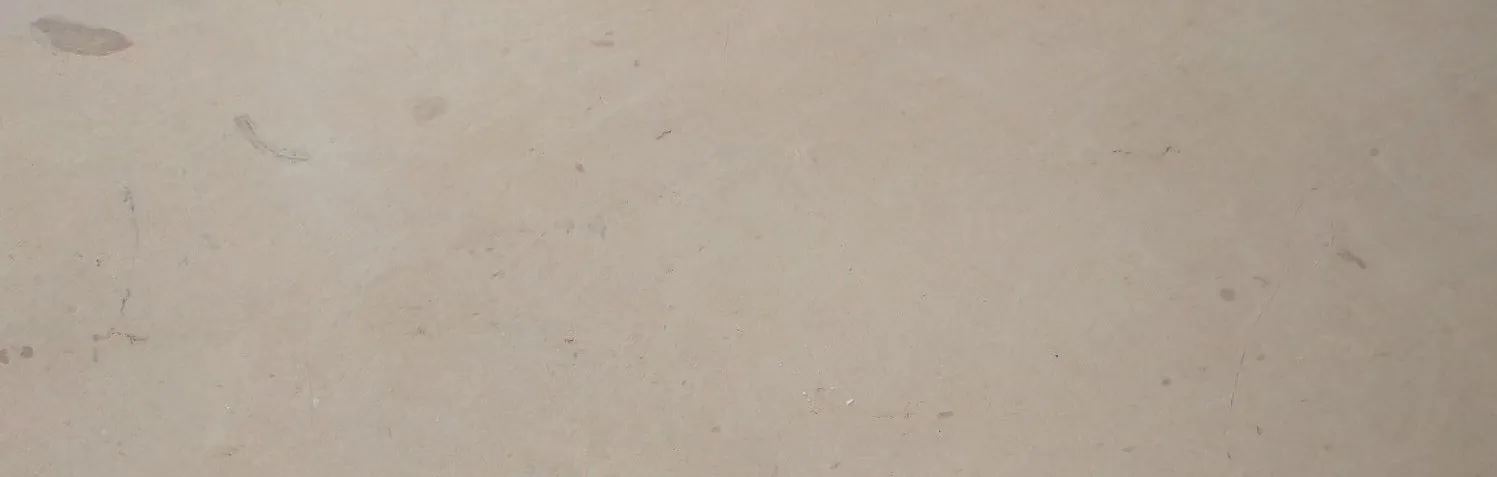 Wide Verona Beige marble surface with a warm cream ground and quiet brown movement