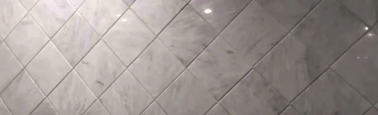 Ziarat White marble tiles laid in a diagonal pattern with fine grey movement