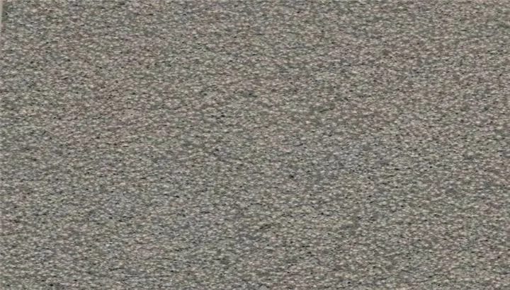 Bush hammered basalt, a peened grey surface with the coarsest grip of the three