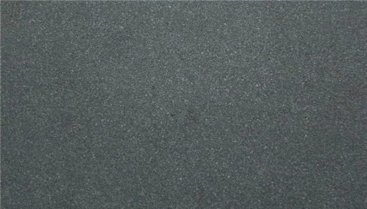 Honed basalt, a flat dark charcoal face with a fine even grain