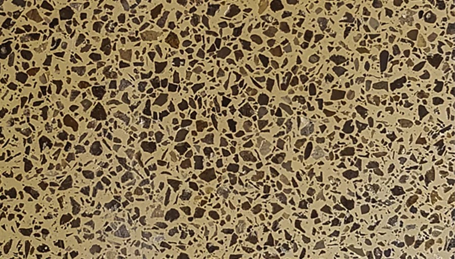 Coarse olive and black exposed aggregate paving field