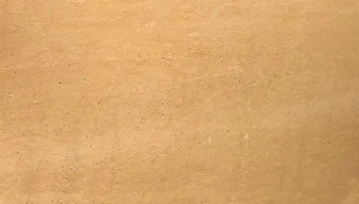 Yellow sandstone with a warm even ochre face and faint bedding lines