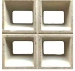 Wet cast screen block WCS-7006, four rounded rectangular openings in a two by two grid with deep chamfered returns, in ivory concrete
