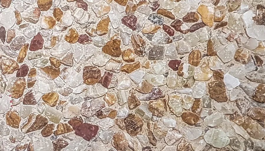 Washed terrazzo in amber, tan and white marble chip on a cream matrix